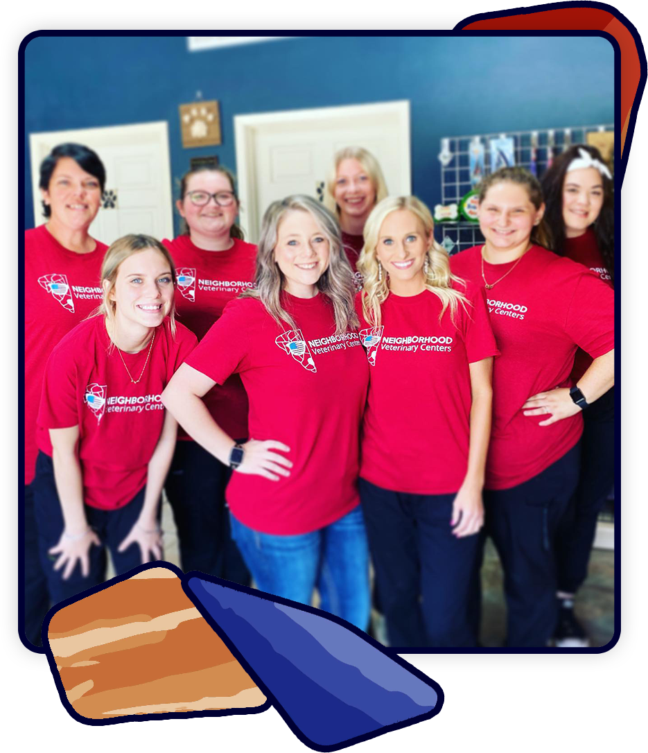 A group of eight smiling women, dressed in matching red t-shirts featuring an ice cream cone graphic and "Neighborhood Creamery" text, stand indoors with light-colored doors behind them. Whether serving sweet treats or caring for pets like a dedicated vet, their camaraderie is unmistakable.